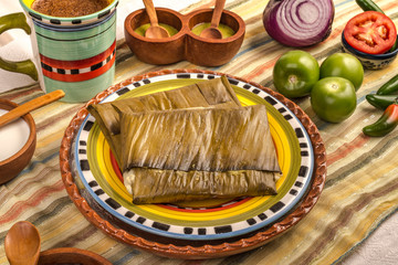 Tamal de Oaxaca, Mexican dish made with corn dough, chicken or pork and chili, wrapped in a banana leaves.