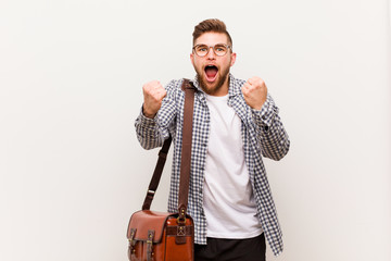 Naklejka premium Young modern business man cheering carefree and excited. Victory concept.