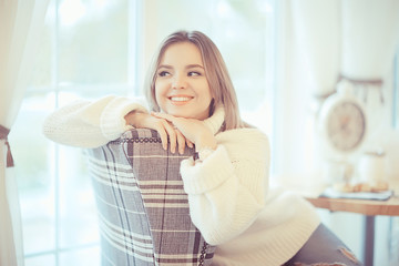 morning breakfast in a bright cafe, a cozy portrait of a young model, lifestyle at home