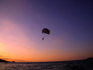 Parasailing at Patong Phuket Thailand at Sunset beautiful colours