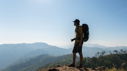 A male hiker photographing on the mountains
