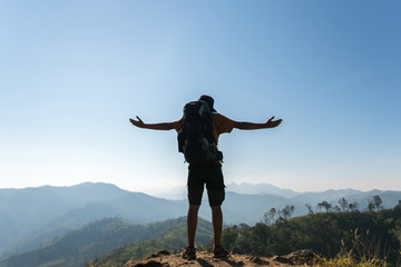 Fototapeta na wymiar Silhouette of a man enjoying the mountain