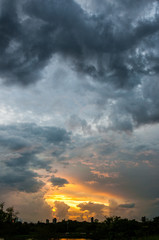 Fototapeta premium Dark and colorful sunset over interior city