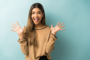 Cheerful Young Woman Against Colored Background