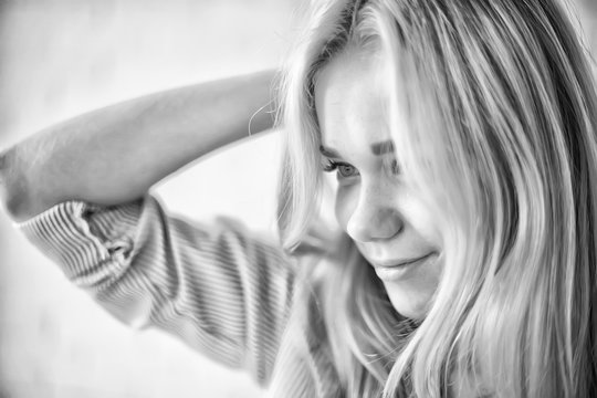 cute blonde black and white / portrait of a beautiful adult blonde girl in vintage style black and white photo