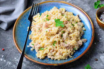 Wheat Porridge with Meat over Dark Background