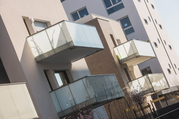 Fototapeta premium Modern concrete balcony s in a cut out on blue sky