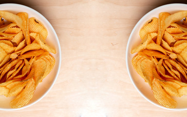 Bowl of tasty ridged potato chips