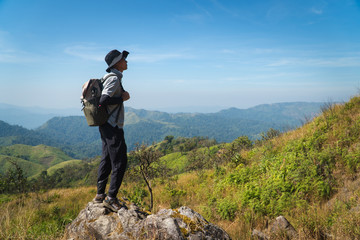 A male hiker standing on top of mountain