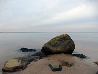 Scenic view of beach against clouds