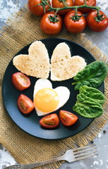 Romantick valentines breakfast. Heart shaped bread and eggs. - 317514940