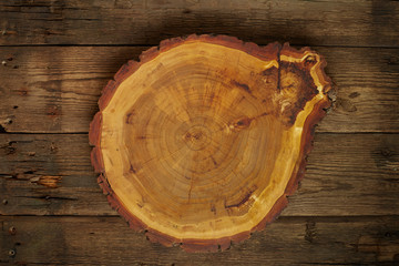 Top view wooden plate on wood background in vintage color tone / copy space