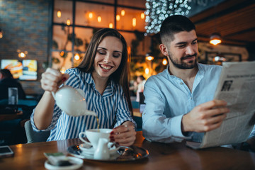 romantic couple in cafe bar drinking tea