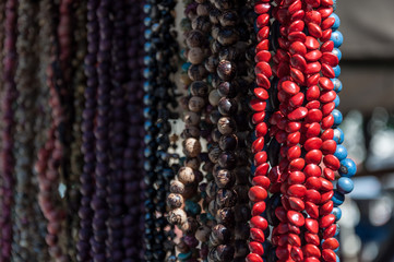 Detail of handmade necklances of local seeds. Craftwork from Salvador