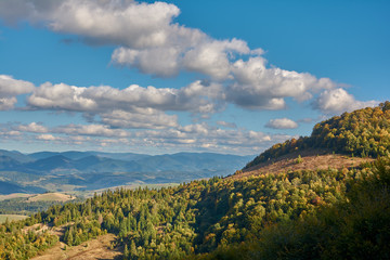 Obraz premium Mountain landscape in Carpathian Mountains, Pylypets, Ukraine. View of the valley and village of Pylypets from Gymba Mountain.