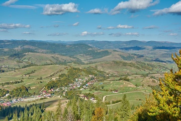 Mountain landscape in Carpathian Mountains, Pylypets, Ukraine. View of the valley and village of Pylypets from Gymba Mountain.