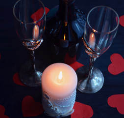 Burning candle, romantic atmosphere. On a wooden board. Valentine's Day. Valentine