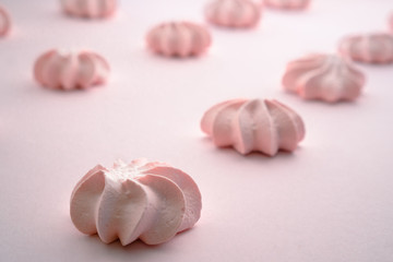 Pink meringue close up with blurred background