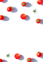 Organic cherry tomatoes on the white background. Top view food frame. Copy space