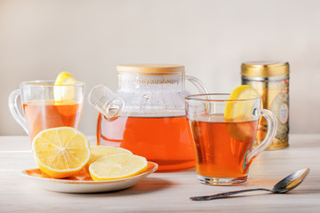 Hot tea with citrus on table. Black tea and lemon.