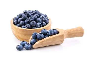 Blueberries in wood bowl  isolated on white background