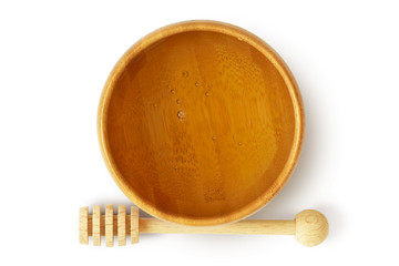 Honey in wooden bowl on white background