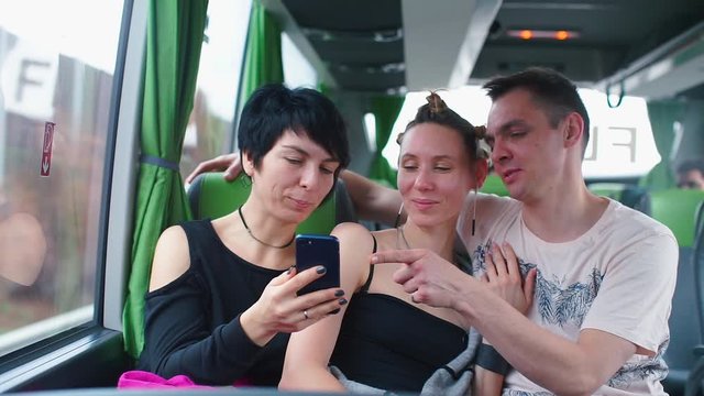 LGBT family rides a tourist bus.