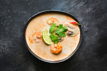 Tom yam kung spicy thai soup with shrimp, seafood, coconut milk, chili pepper.