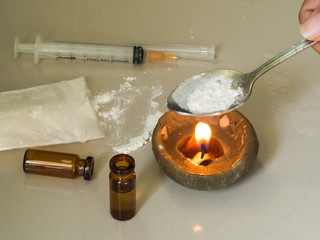 Substance abuse with Ketamine,  candle, syringe 