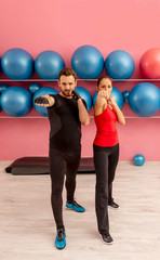 Naklejka premium Couple Training in a Gym