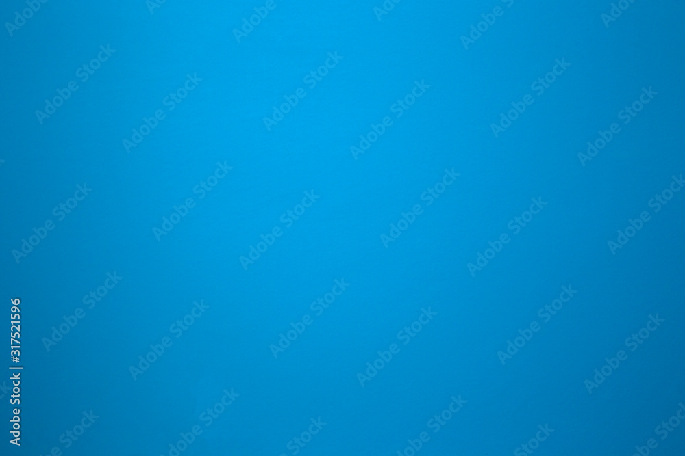 Wall mural aqua blue color on a solid stone wall as background texture. beautiful modern retro color