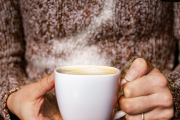 female hands and coffee
