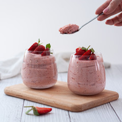 Strawberry mousse in clear glasses - healthy and fresh