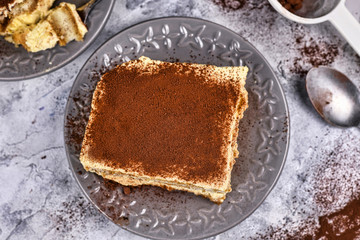 Top view on slice of homemade Tiramisu cream dessert