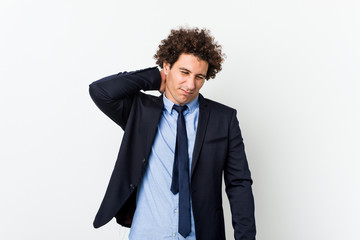 Young business curly man against white background suffering neck pain due to sedentary lifestyle.