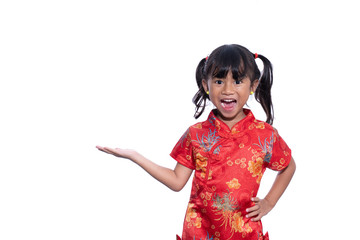 beautiful asian girl in chinese traditional dress presenting copy space
