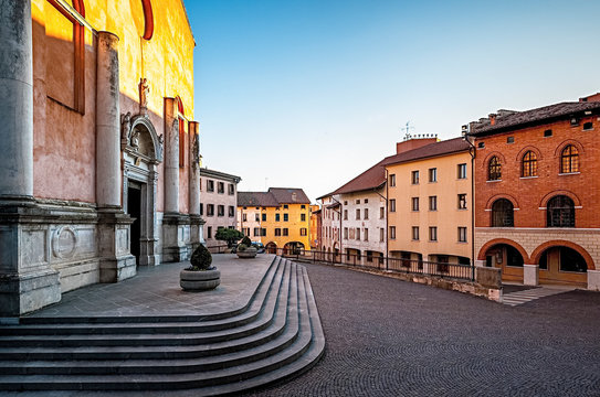 The sun illuminates the ancient Cathedral of Saint Mark in Pordenone. Friuli Venezia Giulia, Italy