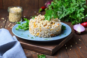 Green Buckwheat with Carrot and Red Onion on a Plate