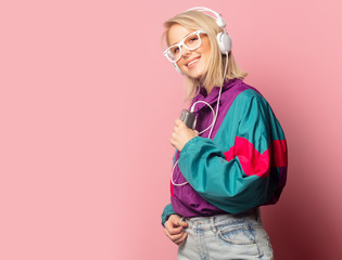 woman in 90s clothes with headphones