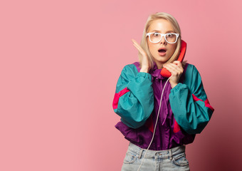 Beautiful blonde woman in 90s clothes with headset