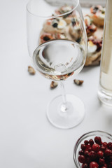 Delicious fresh bruschettas with eggs, salmon, olives and meat , traditional Italian cuisine, ingredients on white  table