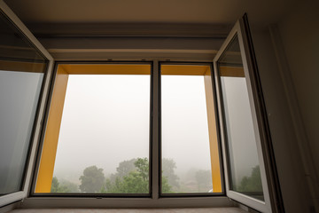 View from the open window in foggy weather