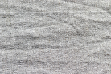 Natural linen fabric texture. Rough crumpled burlap background