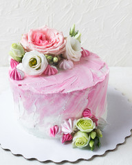 Delicious birthday cake with fresh flowers.