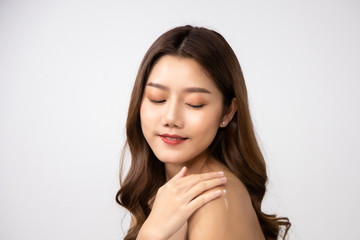 Fototapeta premium Beautiful Young Asian Woman short hair with Clean Fresh Skin. Face care, Facial treatment, Cosmetology, beauty and healthy skin and cosmetic ideas concept.pretty woman holding half of orange .
