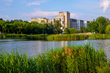 Fototapeta na wymiar Panoramic view of the Sluzew district of Warsaw, Poland with its recreational green spaces and modernistic residential real estate projects