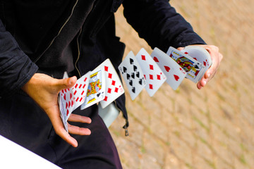 playing cards in the hand