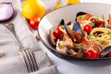 Seafood pasta. Spaghetti with mussels and tiger prawns, traditional pasta with shrimp close-up