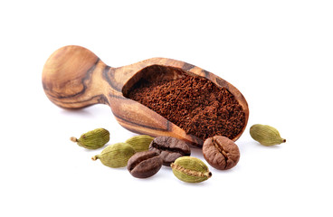 Coffee beans with cardamon and ground coffee  isolated on white background. Coffee beans with spices.