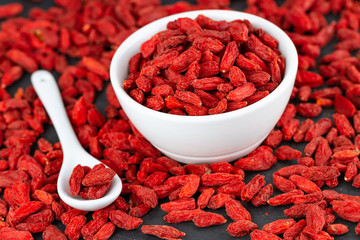 Red Organic Goji Berries In White Cup. Selective Focus